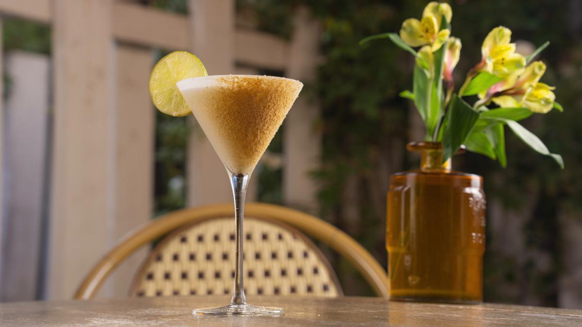 A Key Lime Pie cocktail sits atop a table at FARM restaurant.
