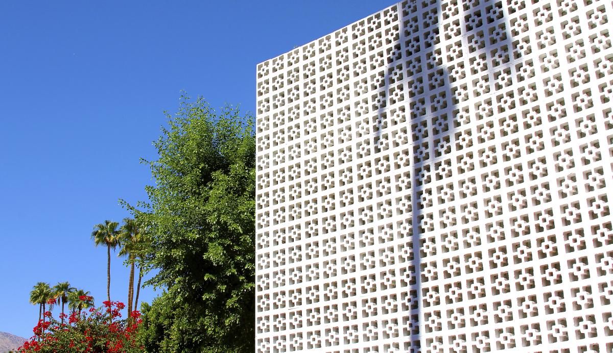 Big white wall at The Parker hotel with Palm Trees