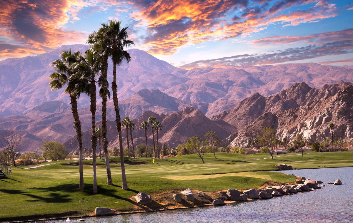 Palm Trees, sunset and mountains.