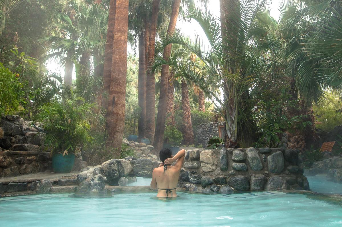 Woman in hot springs pool at Two Bunch Palms in Desert Hot Springs, California