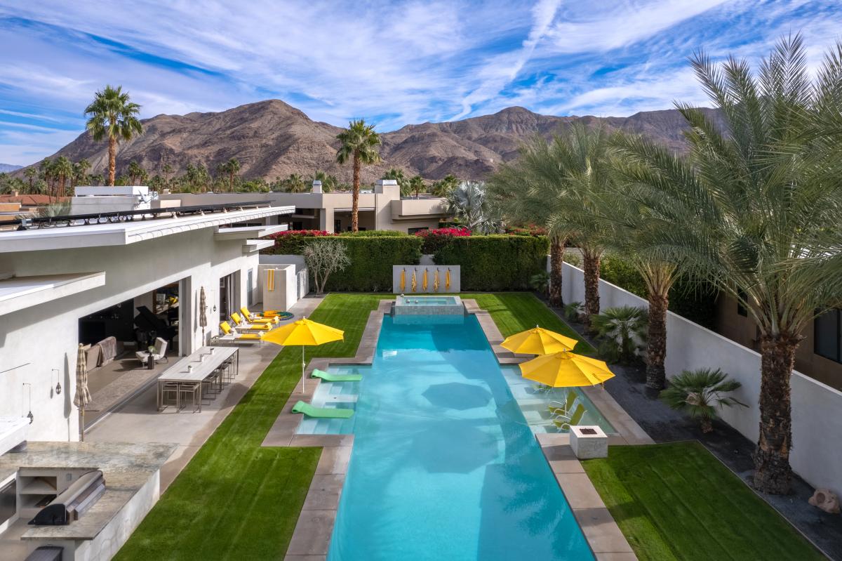 Olympic pool at Dolce and Cabana house with mountains in backdrop