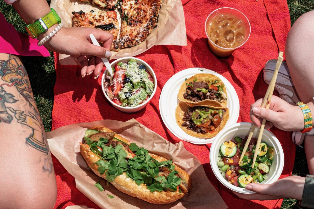 A variety of food on a blanket at Coachella 2023.