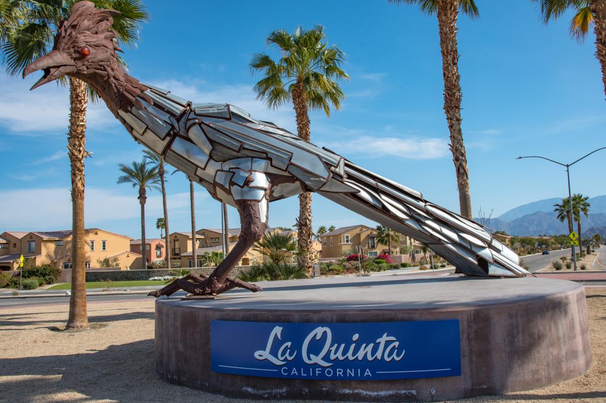Roadrunner sculpture, blue skies