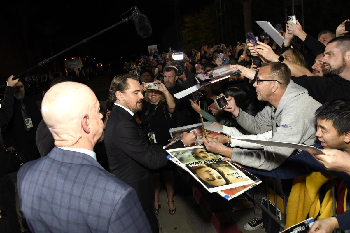 Leonardo DiCaprio signs autographs before the 35 Annual PSIFF Awards Gala in 2024.