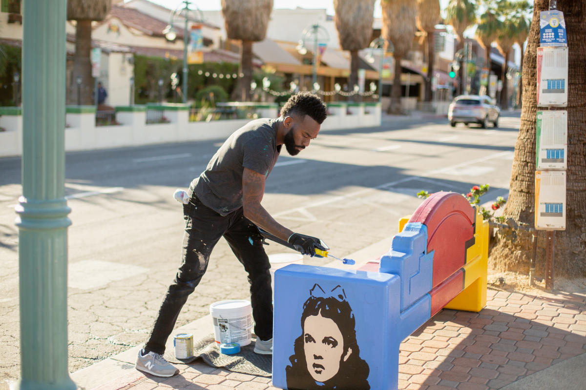 Artist Tysen Knight photographed near one of his benches in downtown Palm Springs