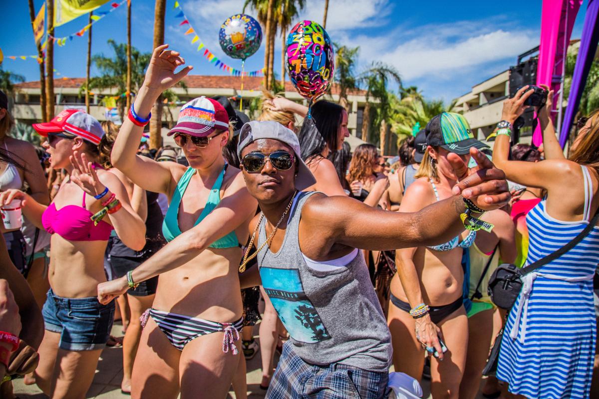 People dancing during a pool party at The Dinah