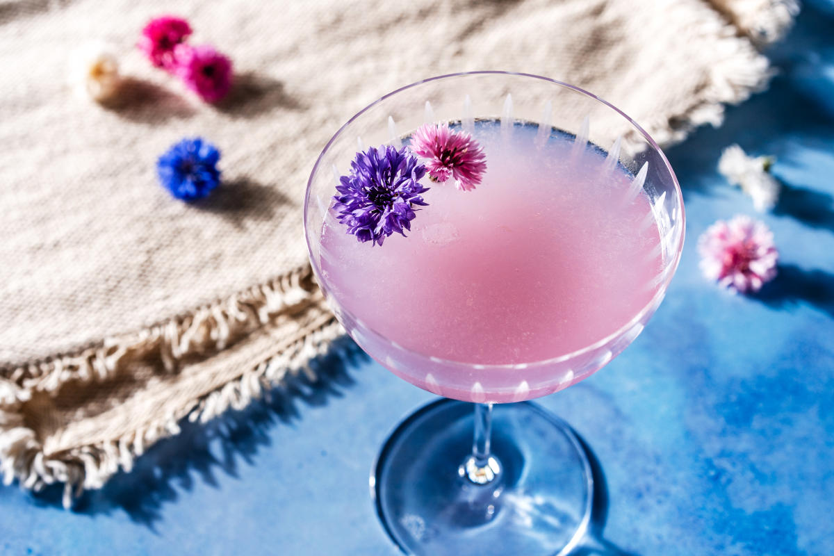Purple Cocktail with flowers in it