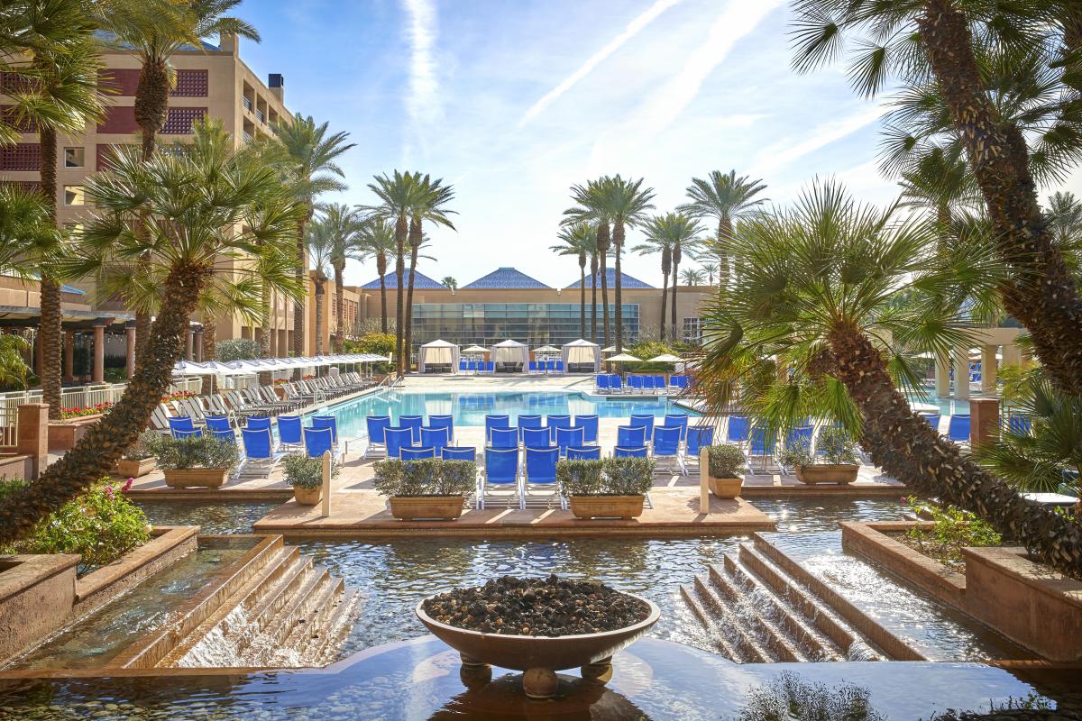 Pool view with pam trees at Renaissance Esmeralda Resort & Spa