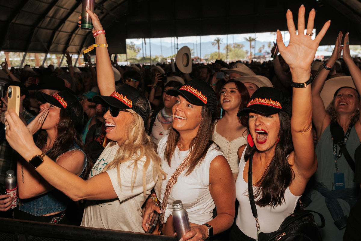 Fans listes to music inside a tent at Stagecoach.