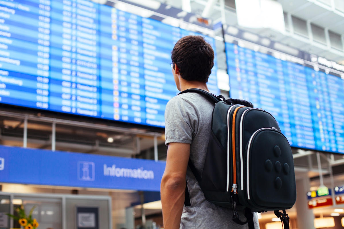 Guy looking at flights