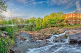 The Liberty Bridge at Falls Park on the Reedy in Greenville, SC on a sunny day