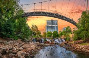 View from beneath Liberty Bridge in Falls Park on the Reedy facing new Camperdown building in downtown Greenville