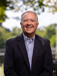Jay Broering headshot at Falls Park on the Reedy on a sunny summer day