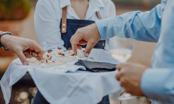 Server serving appetizers at All That Jazz at Restaurant 17 - Euphoria 2018