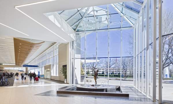 GSP International Airport lobby. There are floor to ceiling windows with a blue sky outside.