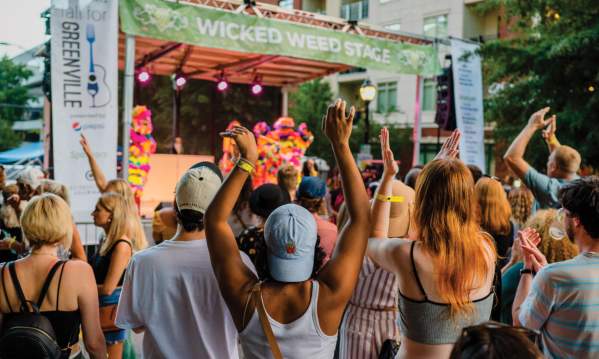 Crowd listening to performers on the Wicked Weed Stage in Fall for Greenville
