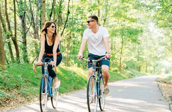 A couple enjoys the great outdoors on the Prisma Health Swamp Rabbit Trail