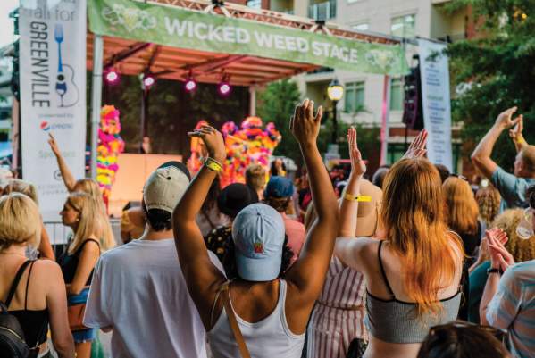 Crowd listening to performers on the Wicked Weed Stage in Fall for Greenville