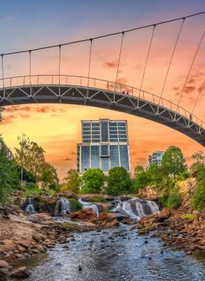 View from beneath Liberty Bridge in Falls Park on the Reedy facing new Camperdown building in downtown Greenville