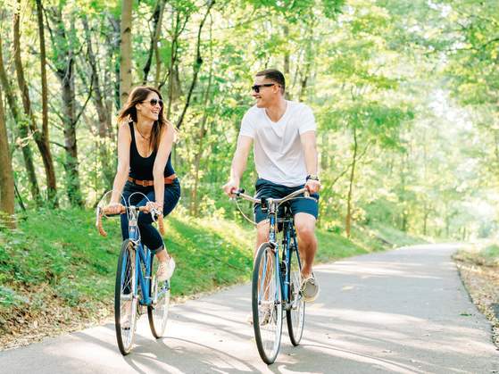 A couple enjoys the great outdoors on the Prisma Health Swamp Rabbit Trail