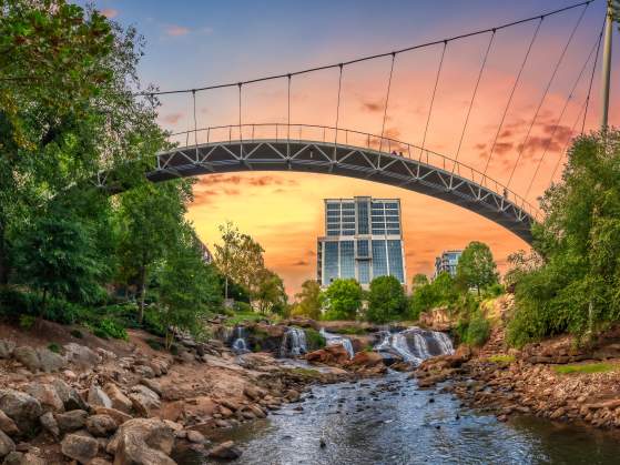 View from beneath Liberty Bridge in Falls Park on the Reedy facing new Camperdown building in downtown Greenville