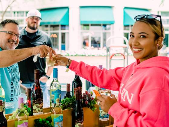 Girl serving drinks at Fall for Greenville 2018