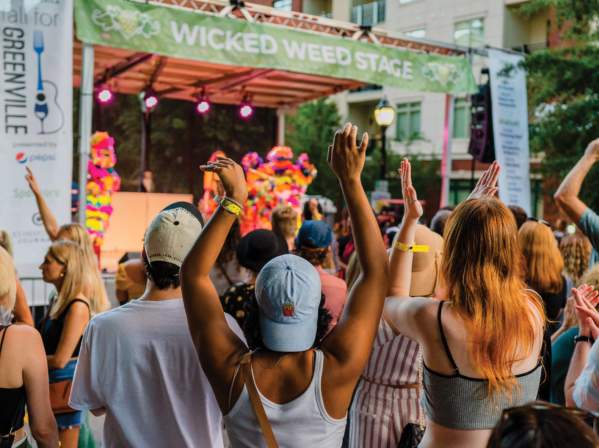 Crowd listening to performers on the Wicked Weed Stage in Fall for Greenville
