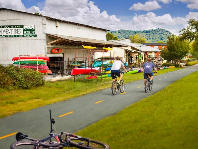 Exterior view of the Swamp Rabbit Trail in front of Sunrift Adventures shop.