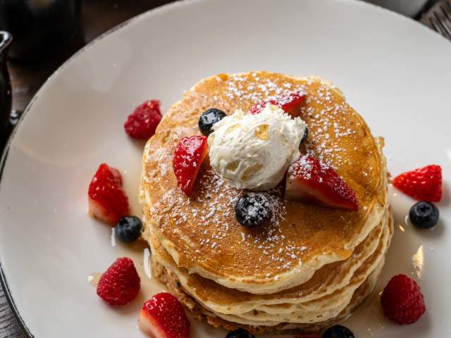 Pancakes, French Toast, and fresh fruit are what's for breakfast at Between the Trees restaurant, within the Grand Bohemian Lodge Greenville.