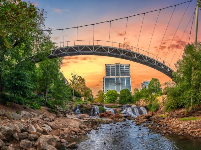 View from beneath Liberty Bridge in Falls Park on the Reedy facing new Camperdown building in downtown Greenville