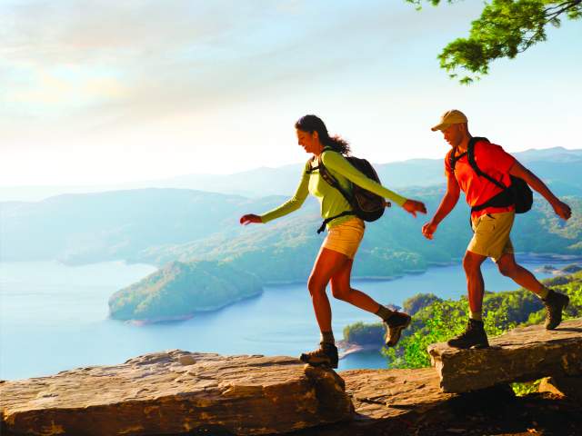A majestic, scenic view of both Lake Jocassee and the Lake Jocassee Gorges can be found at the apex of Jumping Off Rock.