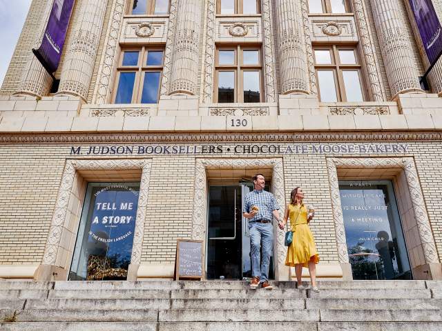 Couple walking out of M. Judson on Main Street