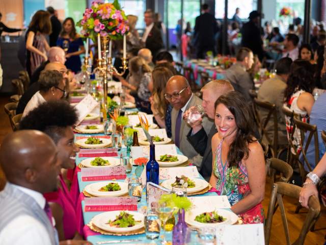 Group of attendees dining at La Fiesta event at Huguenot Loft in 2019