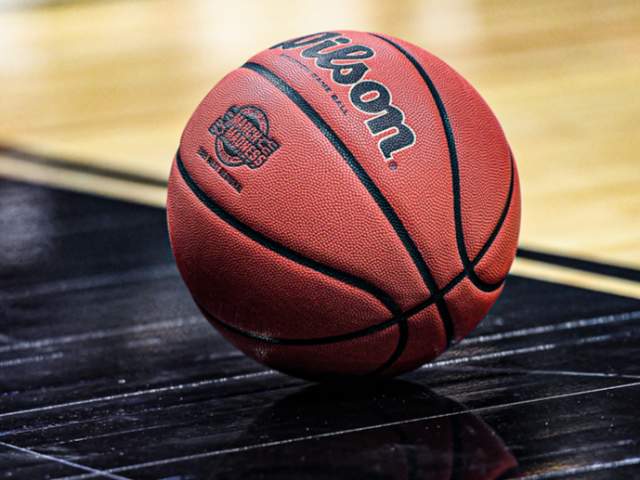 Basketball sitting on a Basketball Court