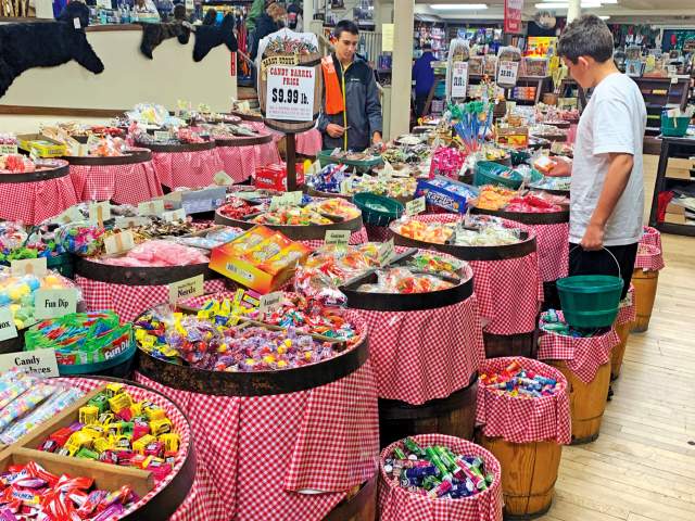 People looking at Candy Barrels at Mast General Store