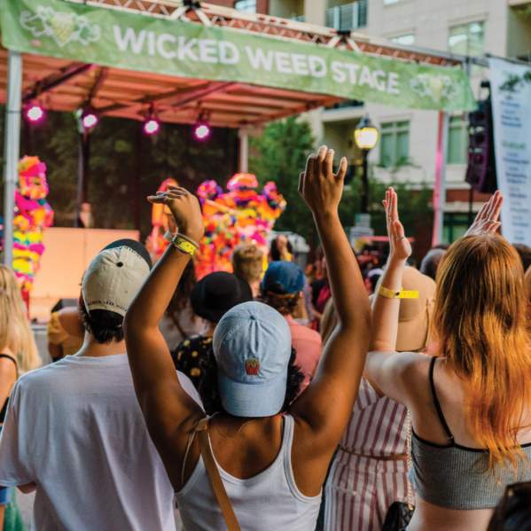 Crowd listening to performers on the Wicked Weed Stage in Fall for Greenville