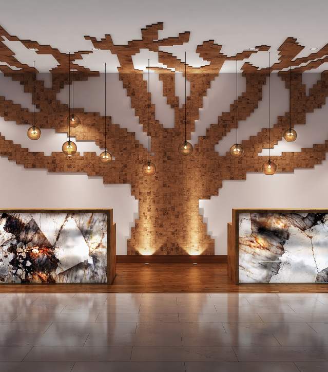 The front desk at the Residence Inn SpringHill Suites, featuring a striking wall design of tree limbs extending onto the ceiling and a glowing marble or rock desk, creating a modern and inviting atmosphere.