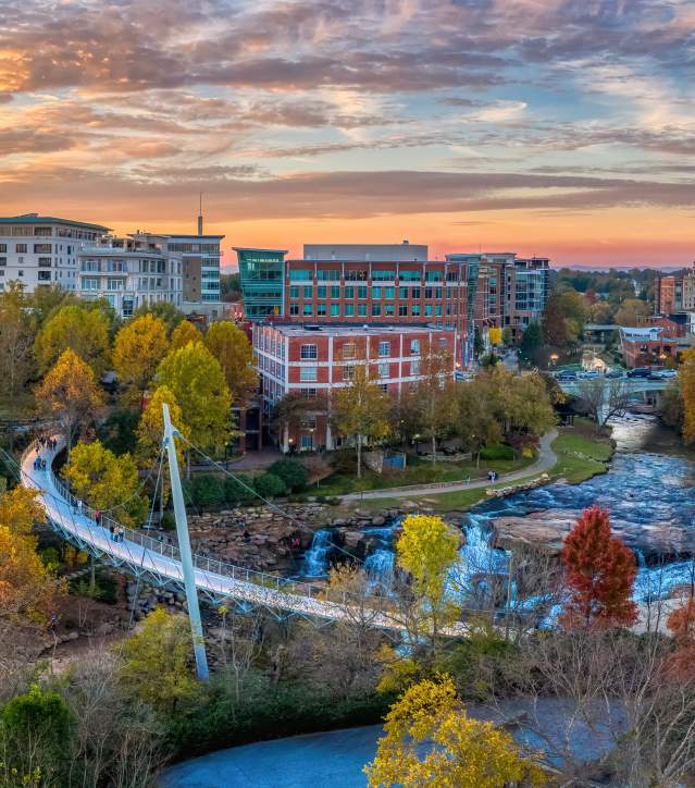 Autumn view over the Liberty Bridge and Falls Park on the Reedy