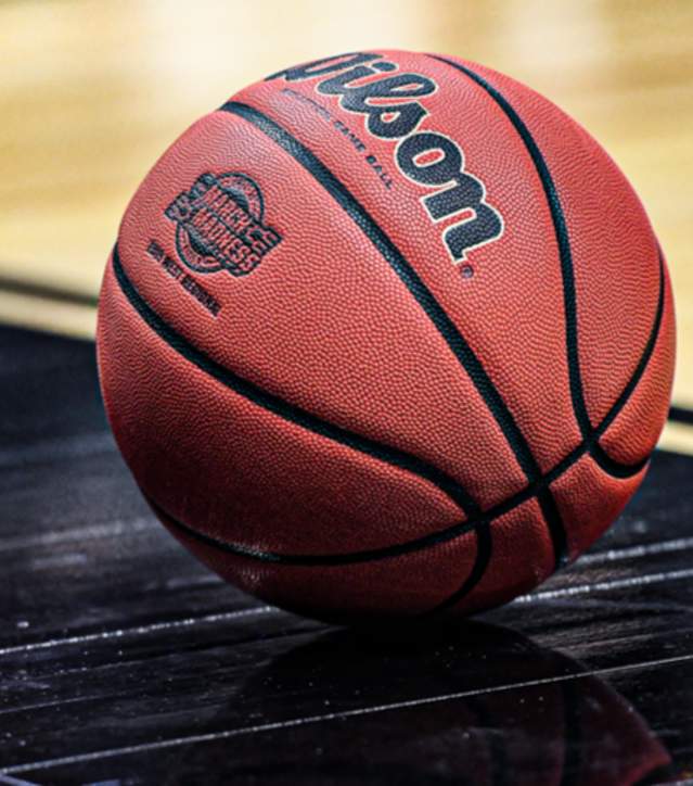 Basketball sitting on a Basketball Court