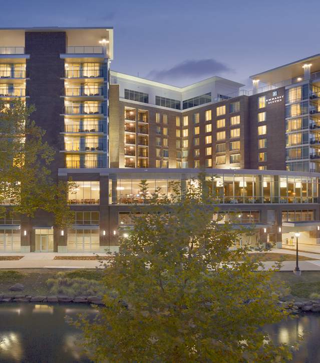 Exterior view at dusk of the Embassy Suites in Greenville.