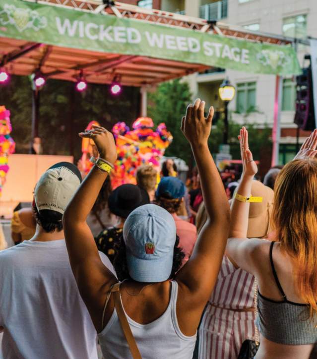 Crowd listening to performers on the Wicked Weed Stage in Fall for Greenville