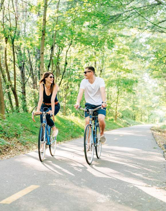 A couple enjoys the great outdoors on the Prisma Health Swamp Rabbit Trail