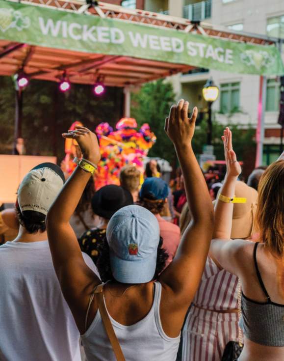 Crowd listening to performers on the Wicked Weed Stage in Fall for Greenville