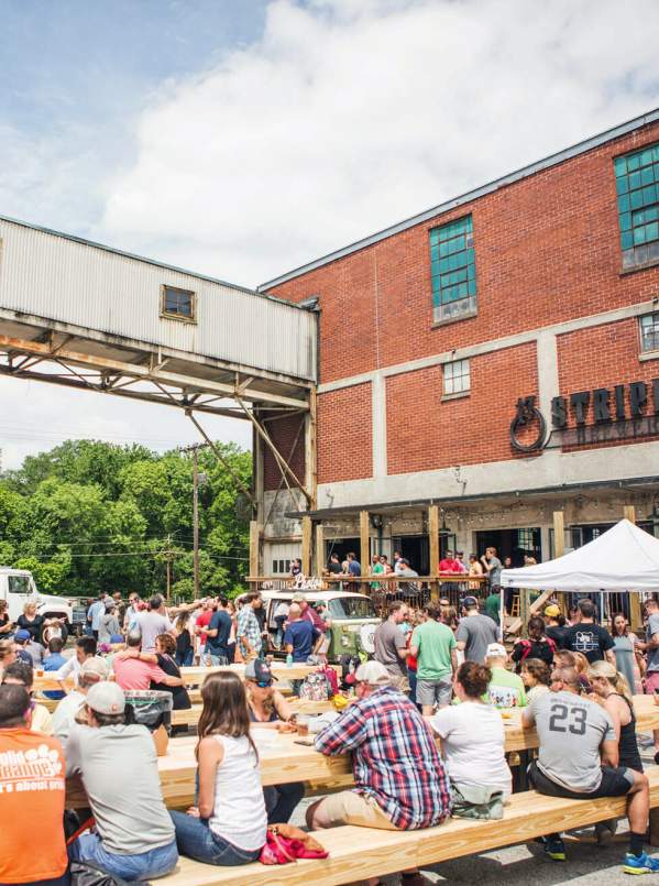 A crowd enjoys a festival at Taylors Mill, just outside the doors of 13 Stripes Brewery in Taylors, SC.