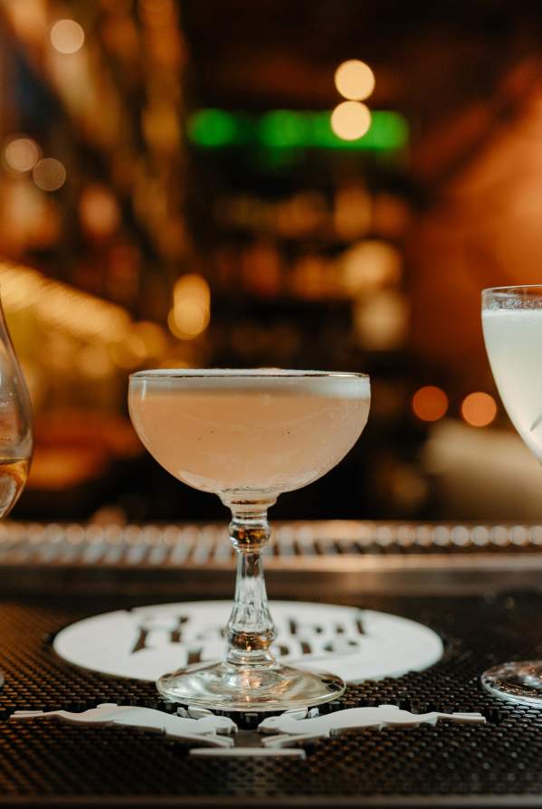 Three cocktails sit atop the bar at The Rabbit Hole in downtown Greenville, SC.