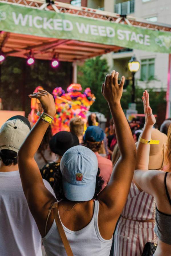 Crowd listening to performers on the Wicked Weed Stage in Fall for Greenville