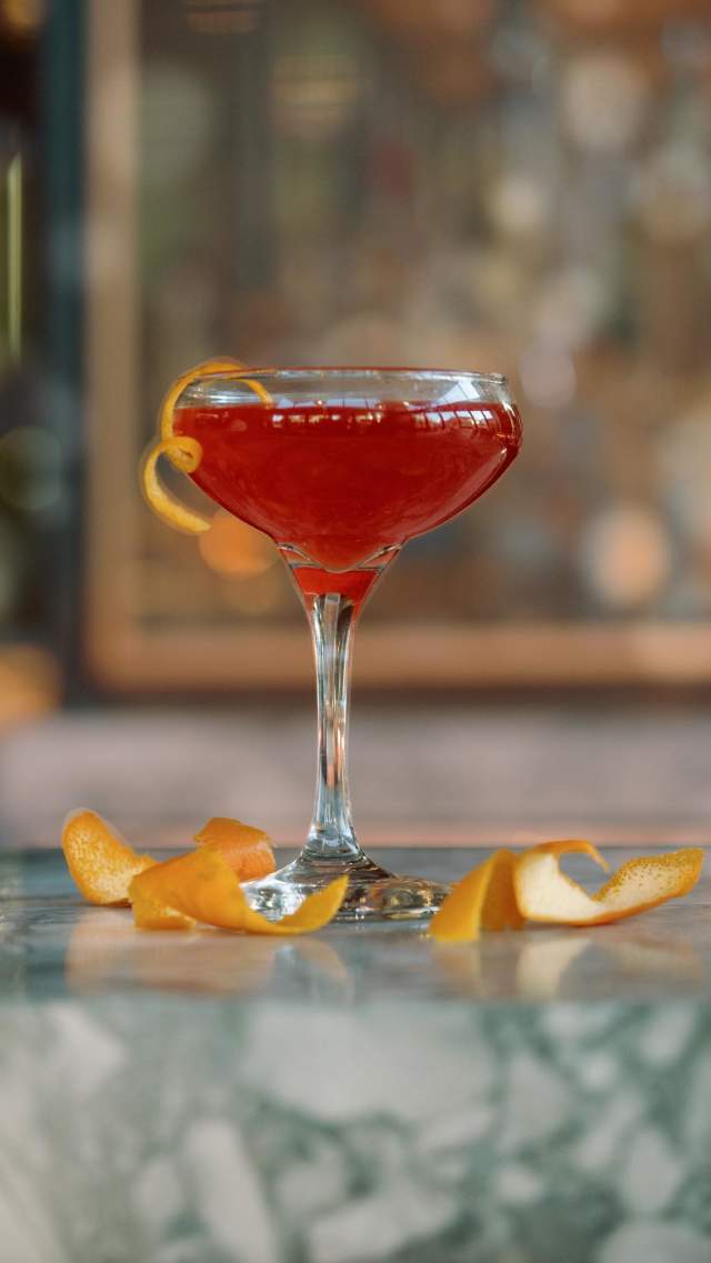 A cocktail surrounded by orange peels on a bar at Paloma in downtown Greenville, SC.