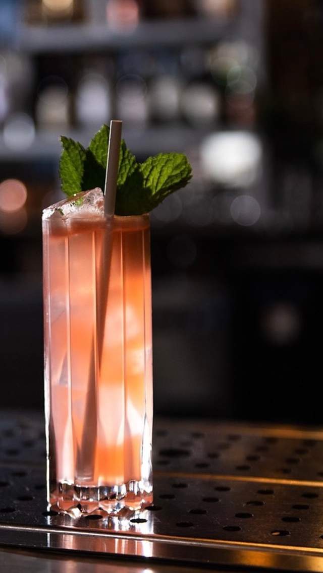 A pink cocktails looks tempting at speakeasy Vault & Vator in downtown Greenville, SC.
