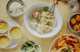 Multiple plates of food at Sum Bar