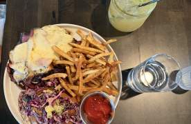 Plated dish at White Wine & Butter and a cocktail